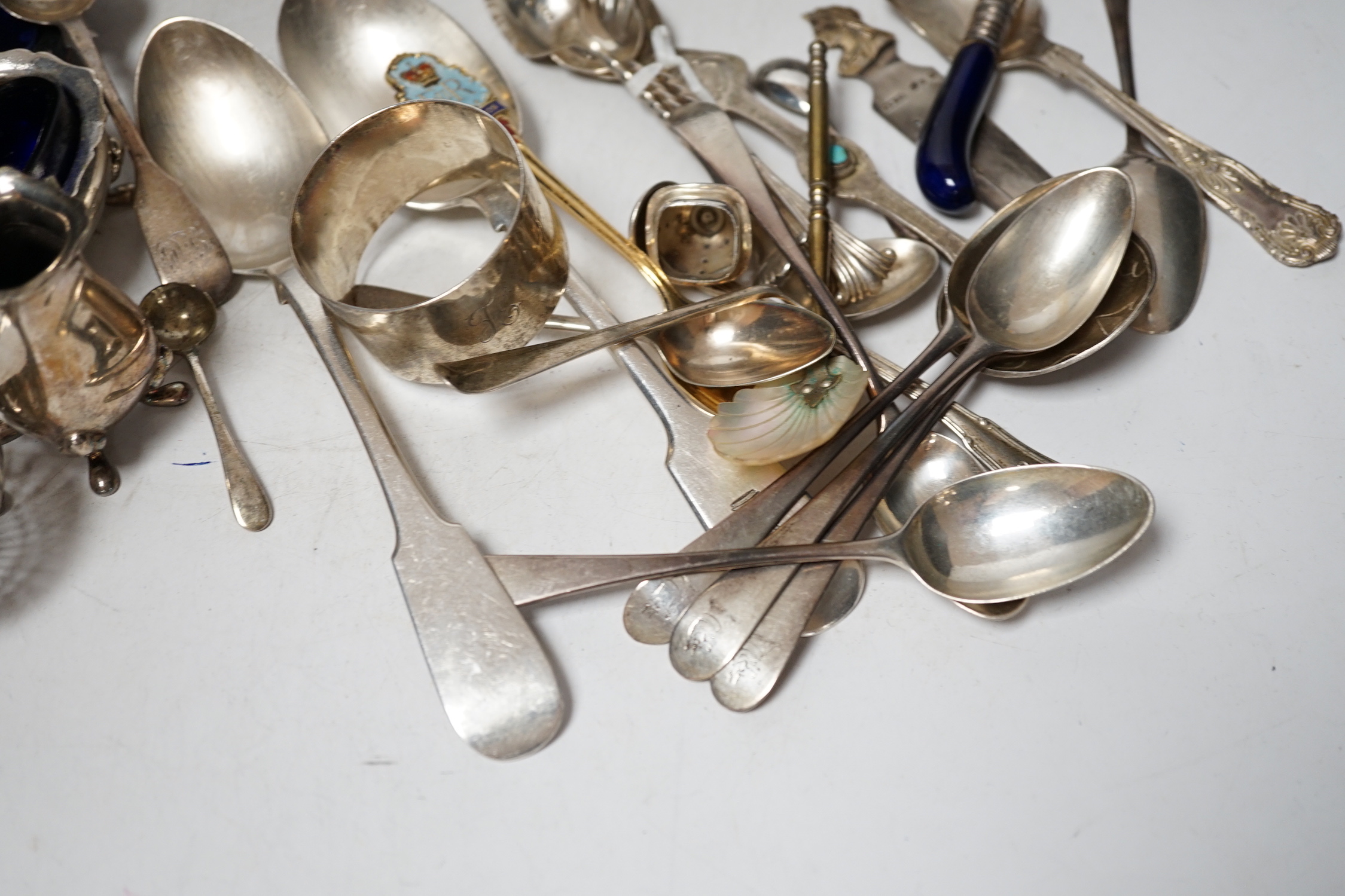 A group of assorted mainly small silver flatware, including 19th century, a small group of sterling spoons, a silver napkin ring and cased silver christening spoon and fork, etc.